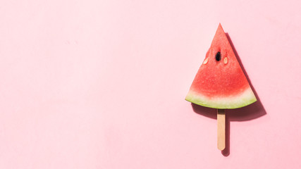 watermelon popsicle. Water melon slice on pink background. Top view or flat lay. Summer, healthy...