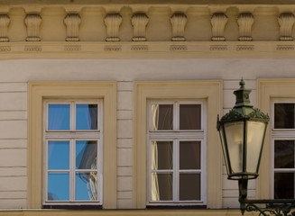 Fototapeta na wymiar Two windows and an old lamp