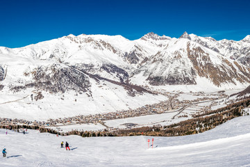 LIVIGNO, ITALY - Feb. 2019 - Skiers skiing in Carosello 3000 ski resort, Livigno, Italy, Europe