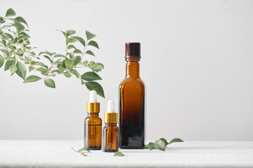 Bottles with aroma oil, medicines on wooden background. Selective focus,horizontal.