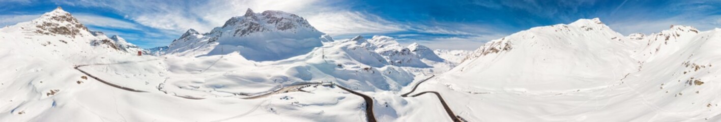 Fototapeta na wymiar Skiers skiing in Carosello 3000 ski resort, Livigno, Italy, Europe