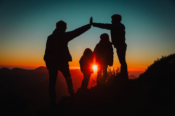 father with kids travel in sunset mountains, family play in nature