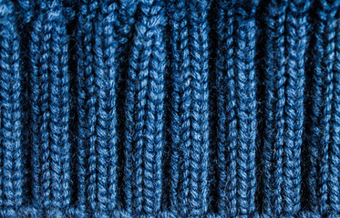 Cozy dark blue knitted texture backround, wool backdrop