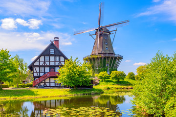 Colorful windmill in Gifhorn of the lake in summer