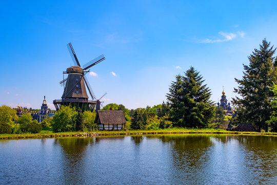 Colorful windmill in Gifhorn of the lake in summer