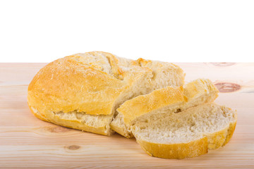 A traditional homemade bread on a wooden surface