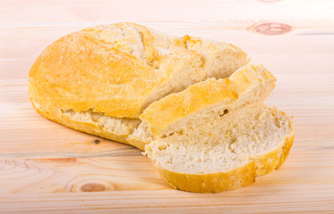 A traditional homemade bread on a wooden surface