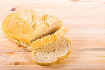 A traditional homemade bread on a wooden surface