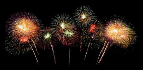 International fireworks festival display at night. Variety of colorful fireworks in holidays celebration isolated on black. Happy New Year Background. © tampatra