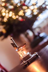 Christmas time: Candle with incense, Christmas tree and presents