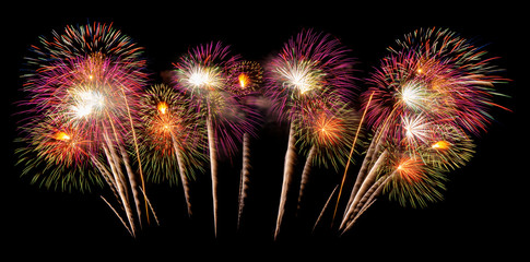 International fireworks festival display at night. Variety of colorful fireworks in holidays celebration isolated on black. Happy New Year Background. © tampatra