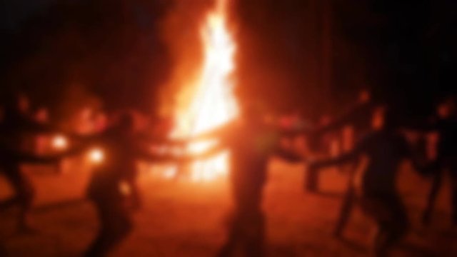 Blurred. Entertainment of youth, night party. The fire and dance in Walpurgis night, and the night of Ivan Kupala, A huge bonfire and a ritual dance