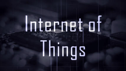 IOT Internet of Things title with a microchip background and a blue color grade.