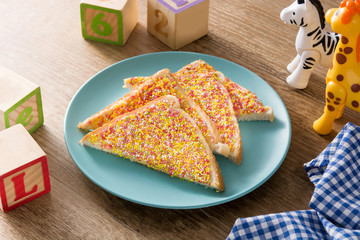 Traditional Australian fairy bread on wooden table
