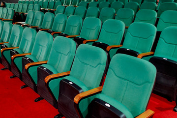 Fototapeta premium Go green for sitting and watching pictures. Placed in multiple locations in the theater. Taken from the side