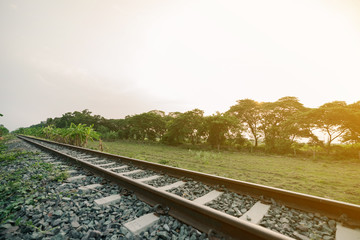 Fototapeta na wymiar The railroad through the countryside in the morning