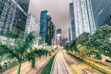 Fototapeta na wymiar HONG KONG - MAY 4, 2014: City streets and traffic at night. Hong Kong hosts 15 million tourists annually