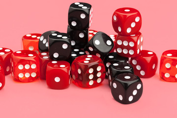 Gaming dice on pink background. Concept for games.