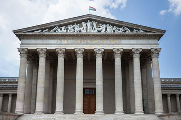 Budapest. Hungary. Museum building with columns on a background of blue sky
