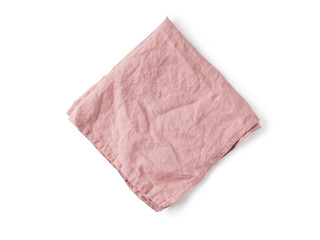 Folded old rose color linen napkin isolated on white background. obscure pink linen napkin. Isolated on white with clipping path. Top view or flat lay.