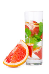 cold drink with different citrus and herbs in glasses on a white background. Cocktail