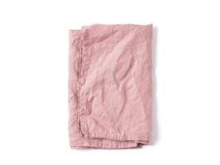 Side view on folded old rose color linen napkin isolated on white background. obscure pink linen napkin. Isolated on white with clipping path. Top view or flat lay.