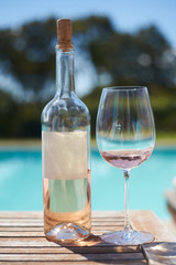 Rose wine bottele glass pool