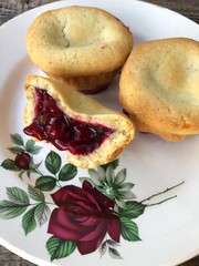 Delicious cupcakes with cherry jam in a plate