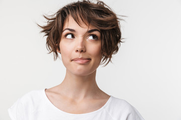 Portrait closeup of elegant woman with short brown hair in basic t-shirt smiling and looking aside