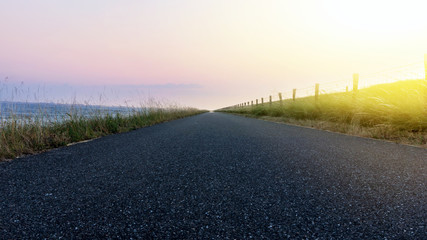 Obraz premium Road to the sky . Paved country road . background tranquility of the nature
