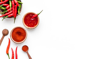 Dry powder and fresh red and green chilli pepper as food ingredient on white table background top view mockup
