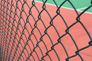Fototapeta premium Wire guardrail for outdoor plastic basketball court