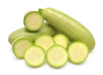 Fresh squash vegetable marrow zucchini whole and rings isolated on white background. Flat lay, top view