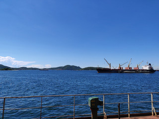 The bulk ship is on operation in anchorage.