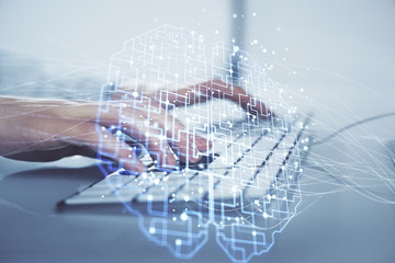 Businessman with computer background with brain theme hologram. Concept of brainstorm. Multi exposure.