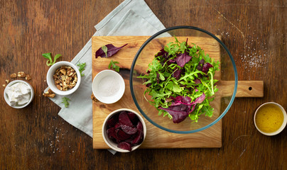 Raw food for cooking fresh salad on wooden table top view