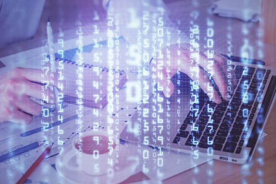 Double exposure of data internet theme hologram with man working on computer on background. Concept of innovation.