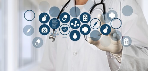 Medical icons and young  doctor with stethoscope