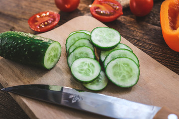 sliced vegetables - cucumbers. on a wooden board.