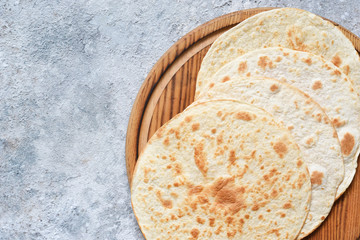 Mexican corn tortillas for sentencing tacos, quesadilla, fajitos, tortilla. View from above.