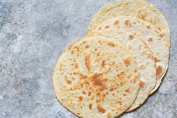 Mexican corn tortillas for sentencing tacos, quesadilla, fajitos, tortilla. View from above.