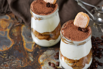Italian dessert tiramisu on an old grunge background