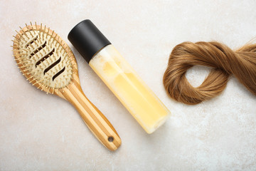 light brown hair, bamboo comb and hair spray