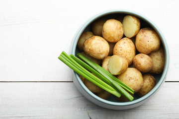 Boiled young potatoes with green onions