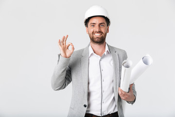 Confident bearded man builder wearing suit