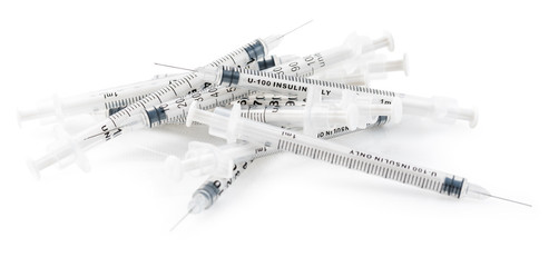 Used syringes for insulin isolated on white
