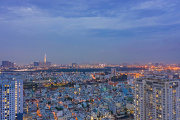 Naklejka premium High Density Suburban area at Twilight Aerial of SE Asian City