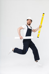 Full length of a confident bearded builder man