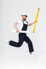 Full length of a confident bearded builder man