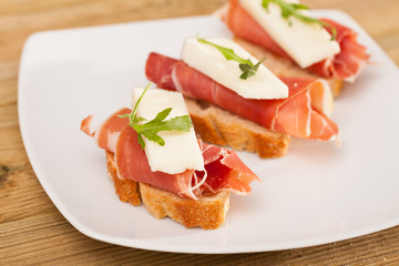 perfect sandwich made with rye bread cheese and Parma ham